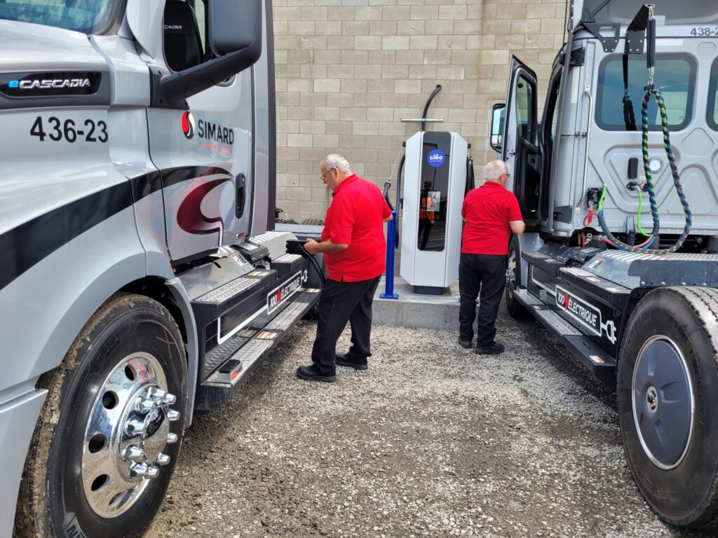 Commercial electric trucks being charged